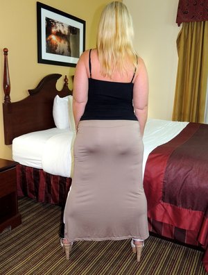 18 year old female Doris G slips off her underwear to pose naked on her bed